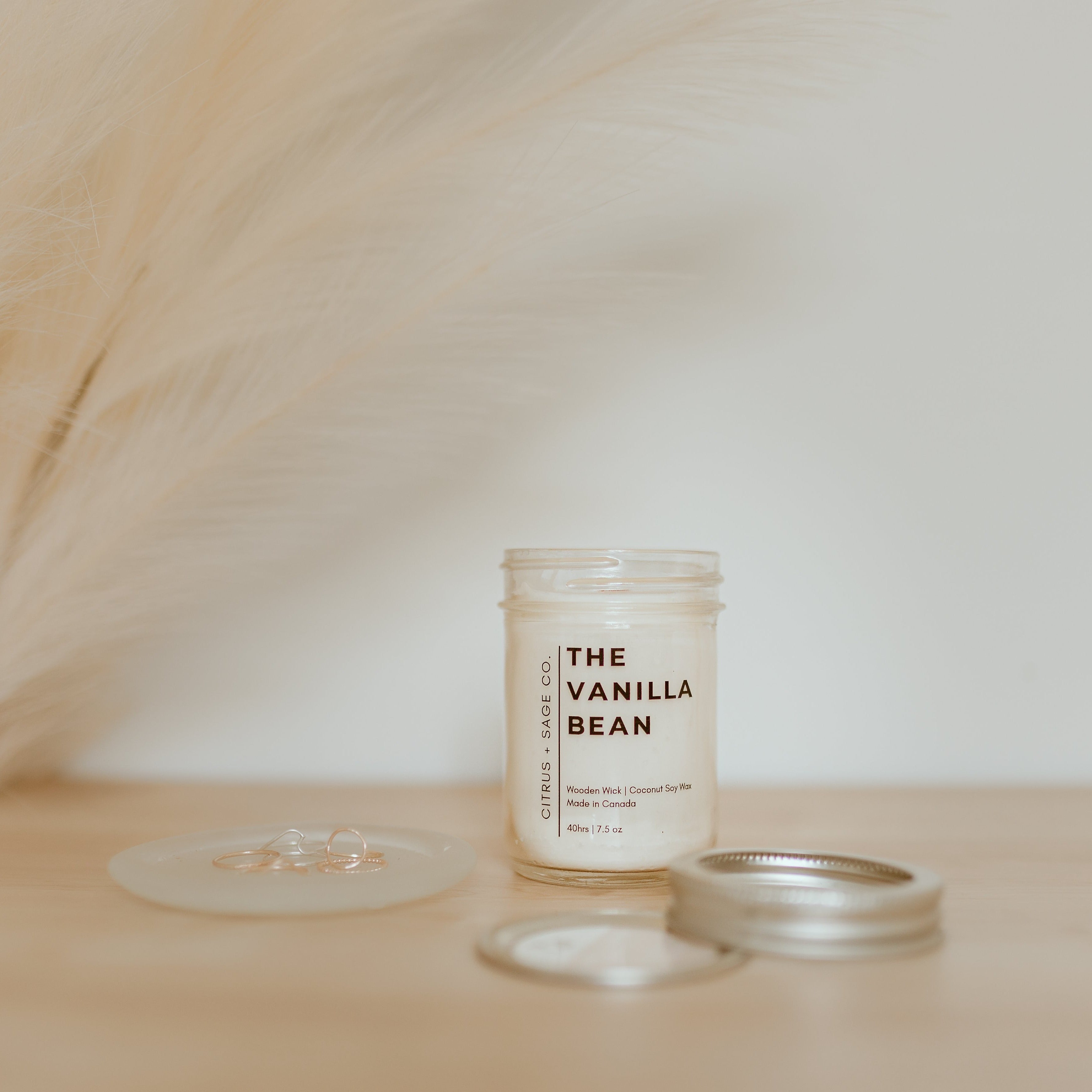 candle with lid laying beside