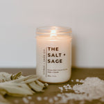 Load image into Gallery viewer, candle in mason jar with sage and salt beside it

