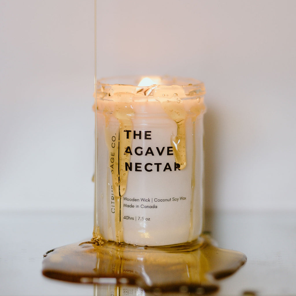 mason jar candle with honey dripping over it