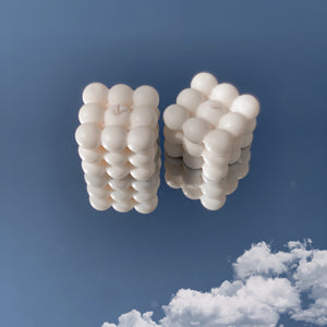 white 3D candle on sky background