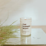 Load image into Gallery viewer, candle in a mason jar with greenery to the left on top of a mirror
