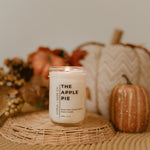 Load image into Gallery viewer, candle on wicker basket with pumpkins in background
