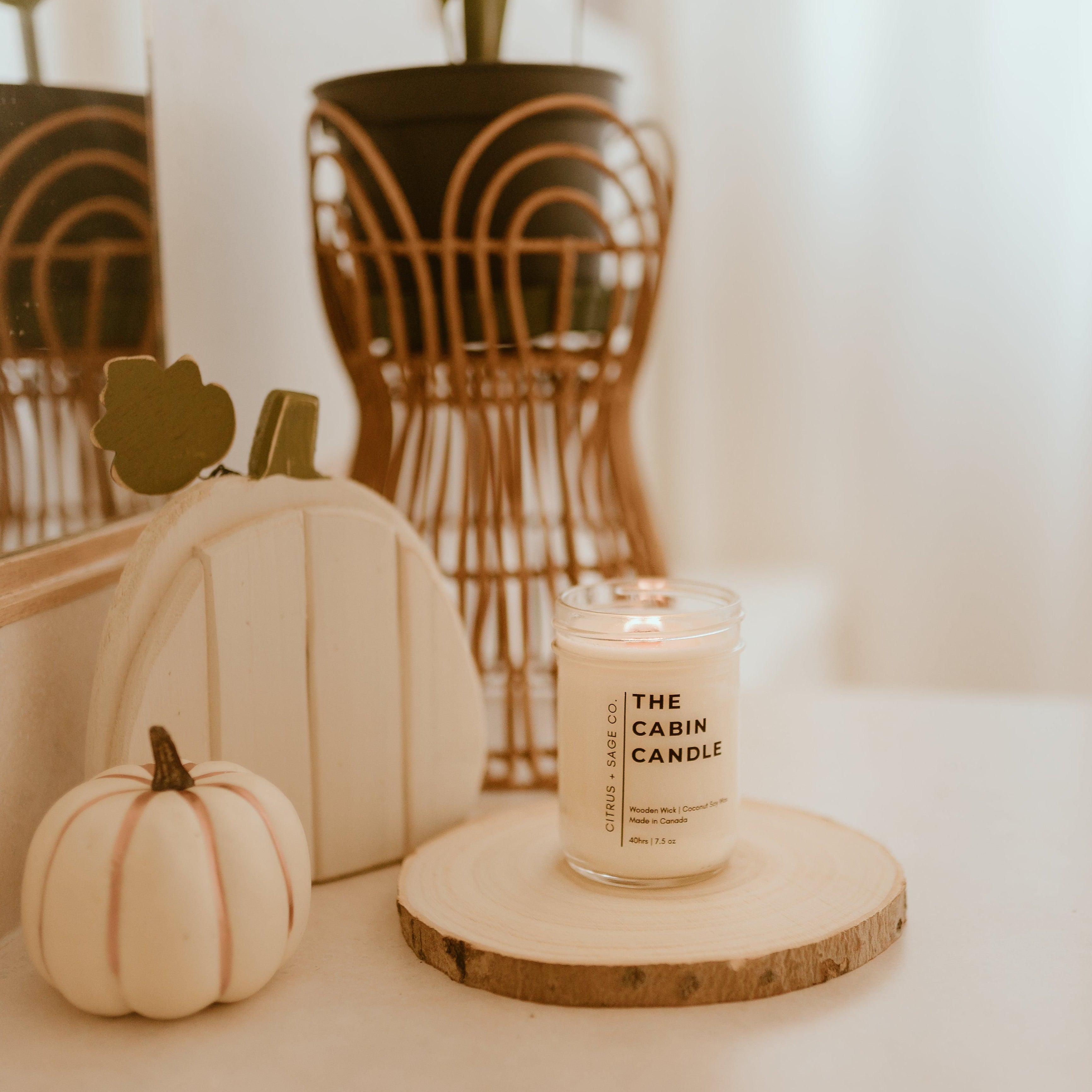 candle on wooden disc