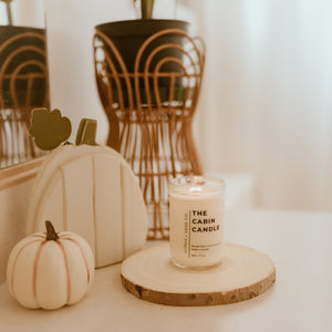 candle on wooden disc